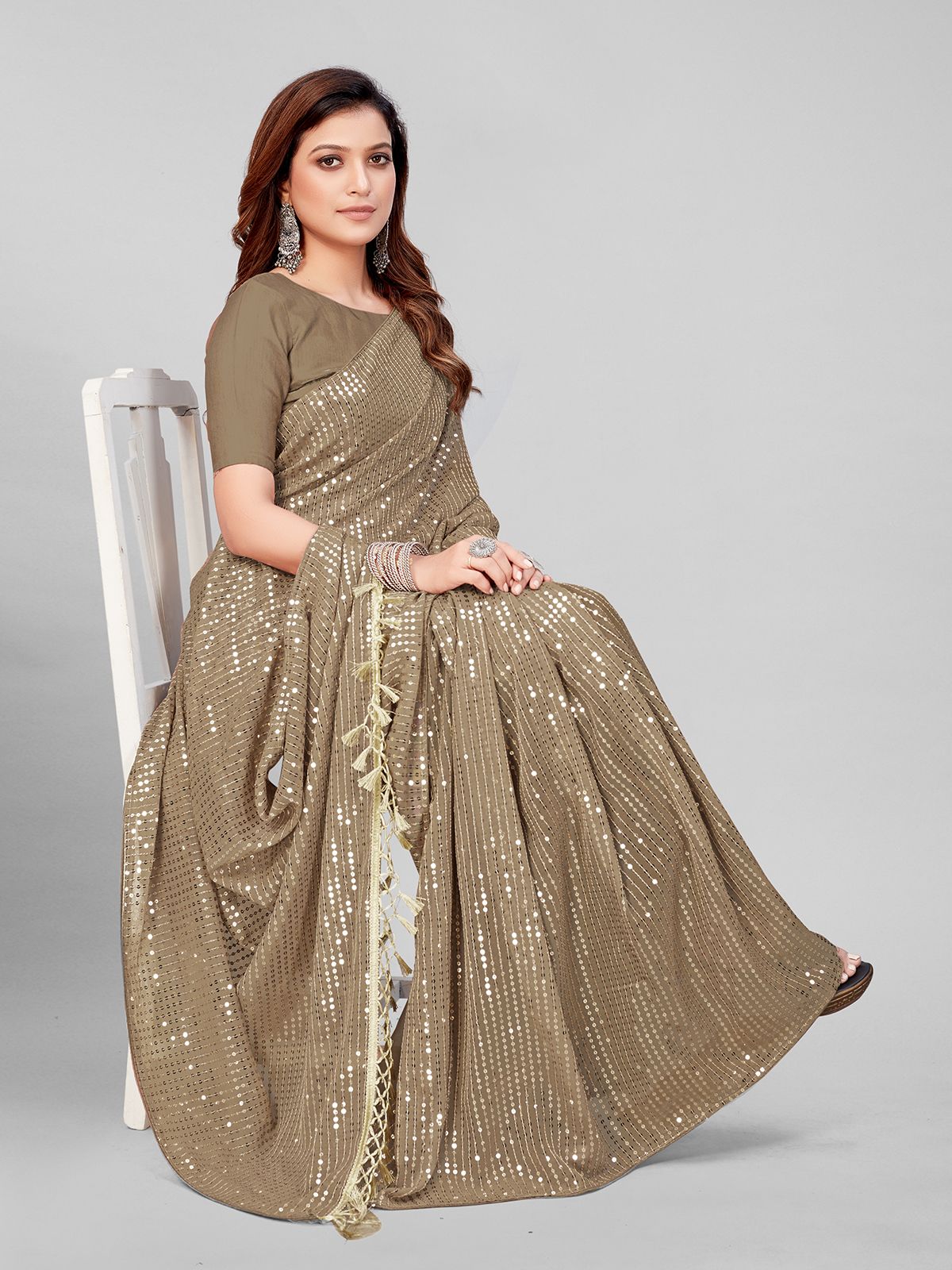 Fancy Sequined Embroidered Beige Coloured Georgette Saree with Blouse Piece
